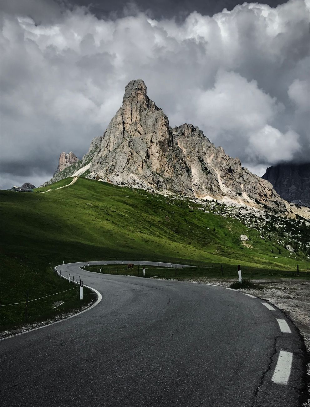 Dolomite mountain pass overlooking deep alpine valley