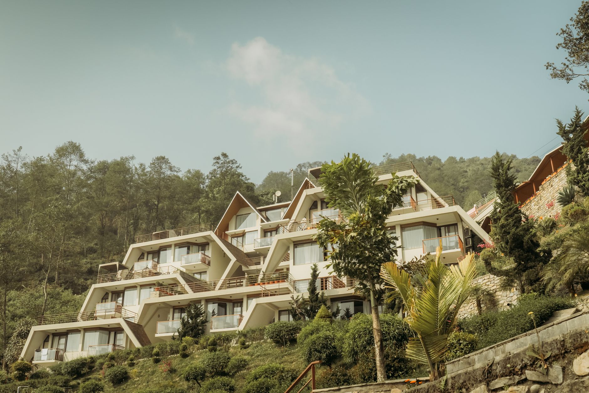 Private architectural villa nestled in green hillside